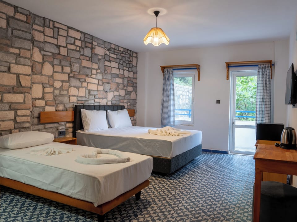 Standard Room, Balcony, Partial Sea View | Premium bedding, WiFi (free), individually furnished, bed sheets