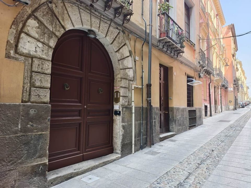 Historic alley and ancient door, Cagliari Castello, pedestrian center.