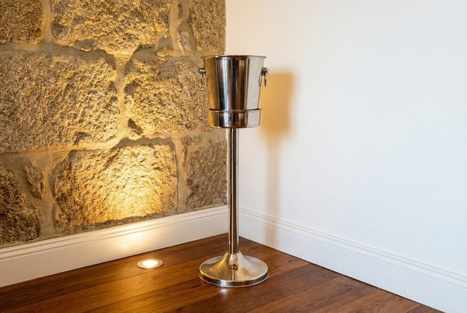 A champagne stand in the bedroom sets the tone for a special celebration stay.
