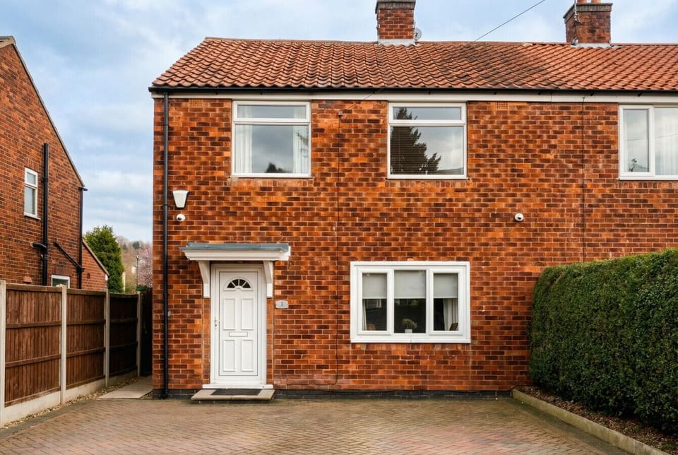 Your own brick semi-detached home with private driveway parking right at the front door.