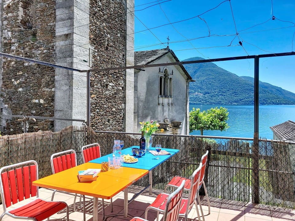 Furniture, Chair, Outdoor Furniture, Outdoor Table, Balcony, Kitchen & Dining Room Table, Flowerpot, Houseplant, Shade, Restaurant