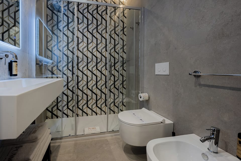 Shower, hair dryer, slippers, towels
