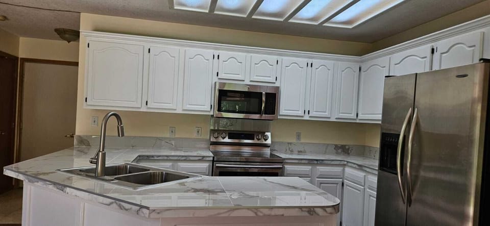Bright updated kitchen with stainless appliances and spacious counters
