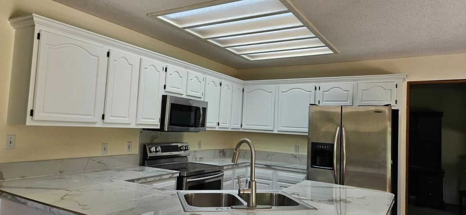 Bright updated kitchen with stainless appliances and spacious counters