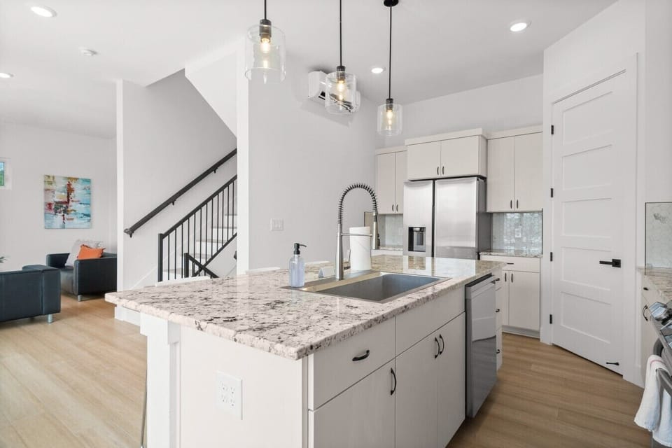 The kitchen flows straight into the living room, so the cook is always part of the conversation.