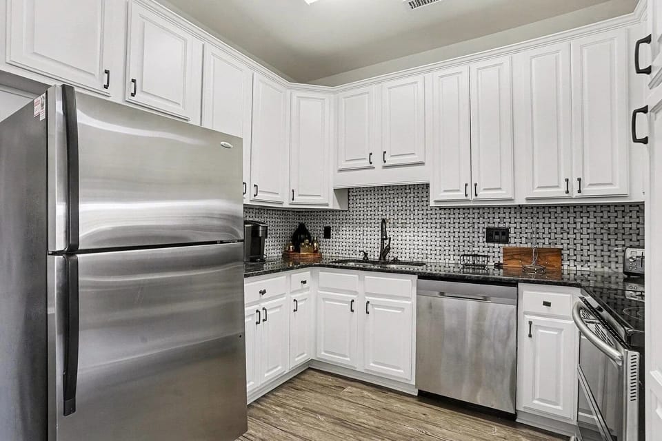 Fully equipped kitchen with stainless appliances for easy beach-week meals