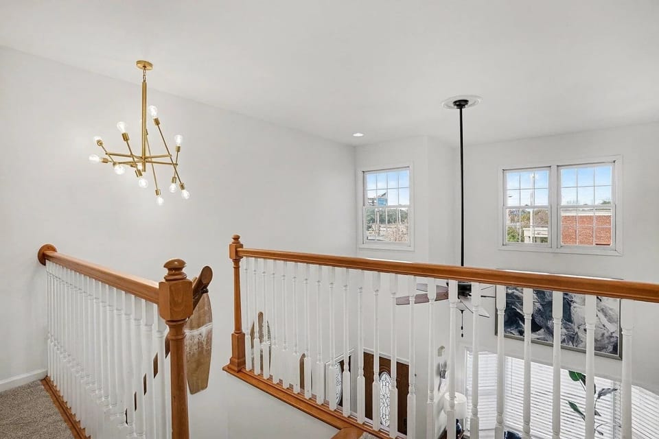 Sunny overlook landing leads to the upstairs bedrooms
