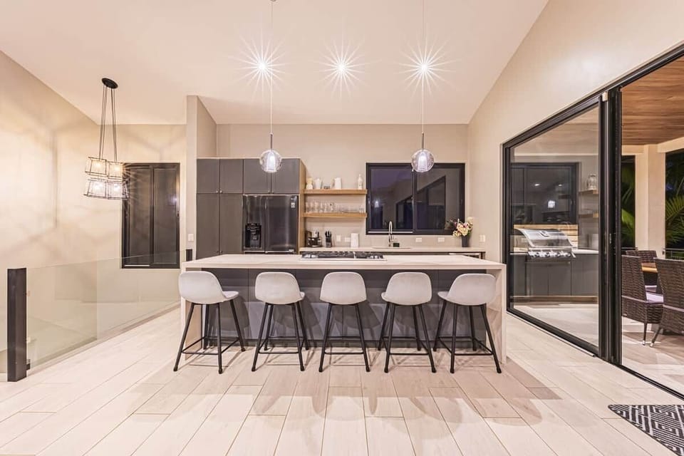 Fully equipped gourmet kitchen, in an open- plan living-dining area overlooking incredible ocean views.
