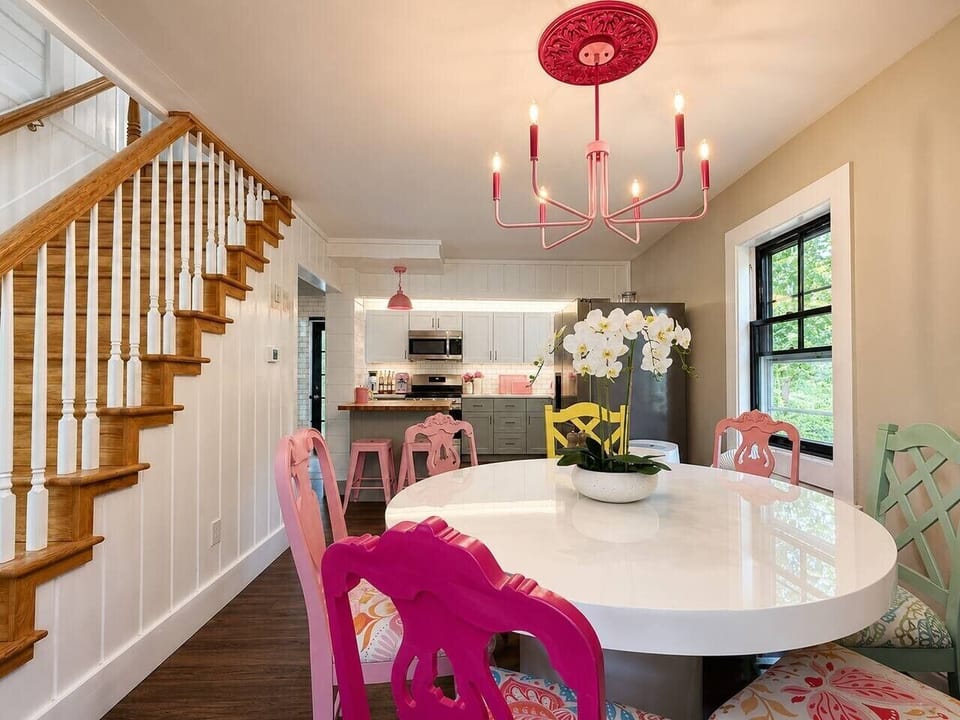 Gather around the spacious dining table with seating for memorable meals together.