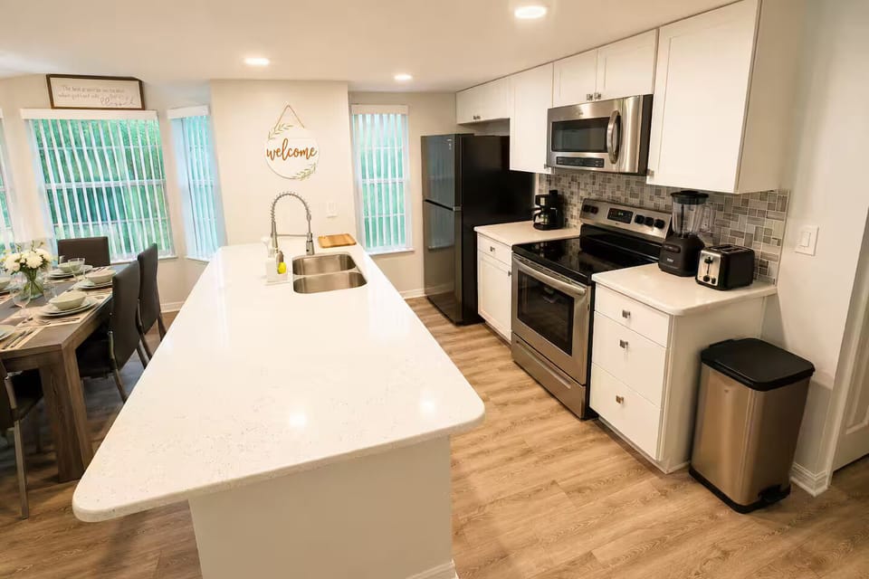 Fully equipped kitchen with a spacious island and modern appliances.