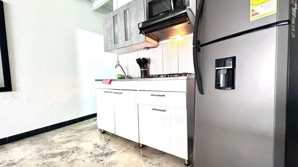 Fridge, microwave, cookware/dishes/utensils