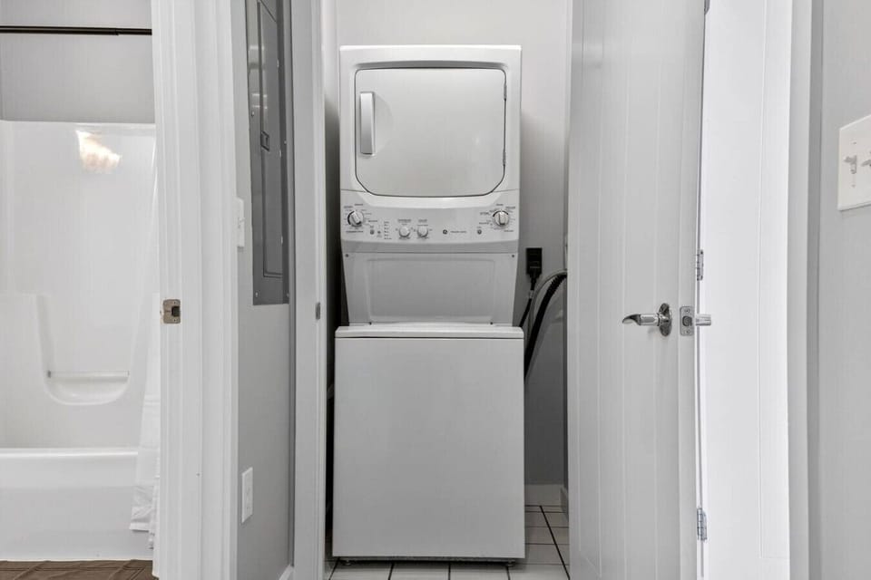 In-unit washer and dryer conveniently located near the bathroom.
