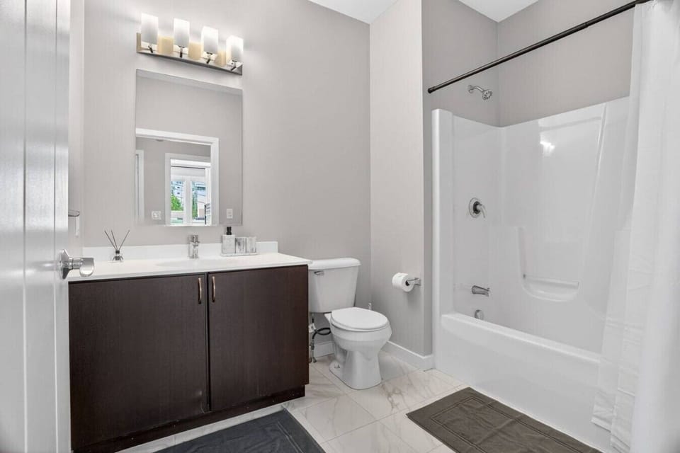 Full bathroom with tub and shower combination.