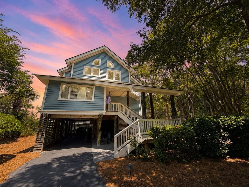 Exterior view of this classic 4-bedroom Seabrook Island beach home, privately tucked away in the North Beach section.