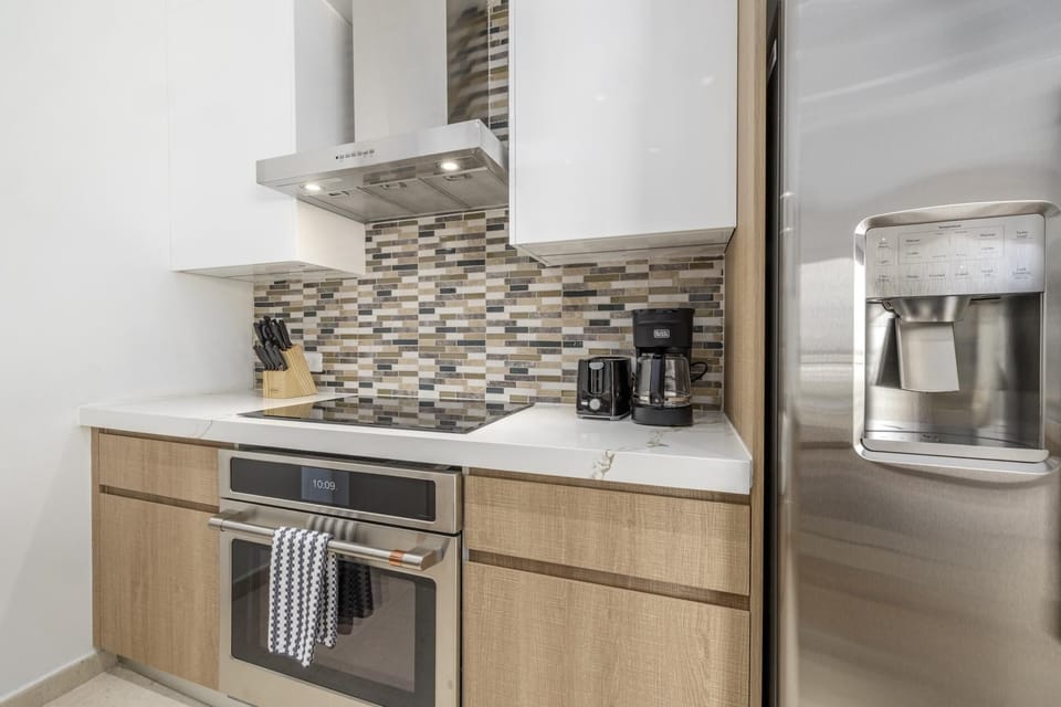 Modern kitchen with everything you need to prepare meals, snacks, and morning coffee during your stay.