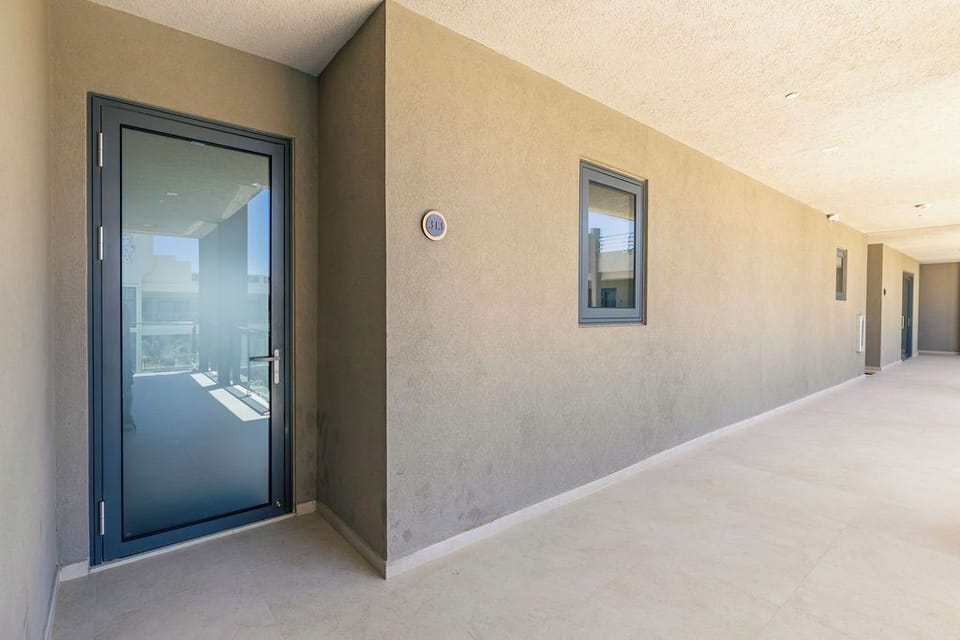 Your private entrance awaits. A secure, modern entryway welcomes you home — sleek design and easy access from the moment you arrive.