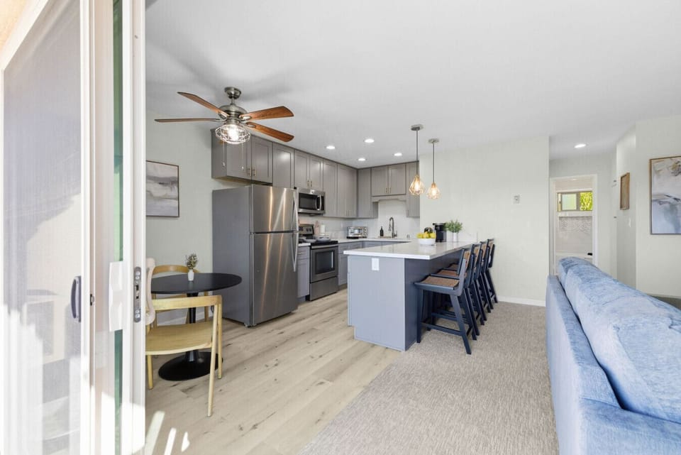 Spacious open layout with living room, kitchen, and dining area.