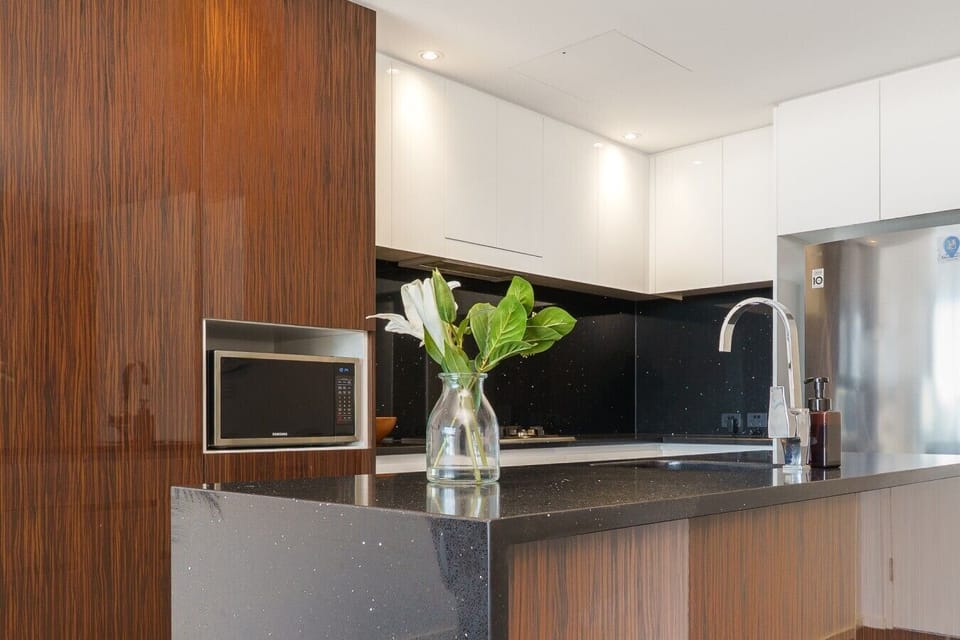 Prepare your favourite meals in this sleek, well-equipped kitchen designed with both style and convenience in mind.