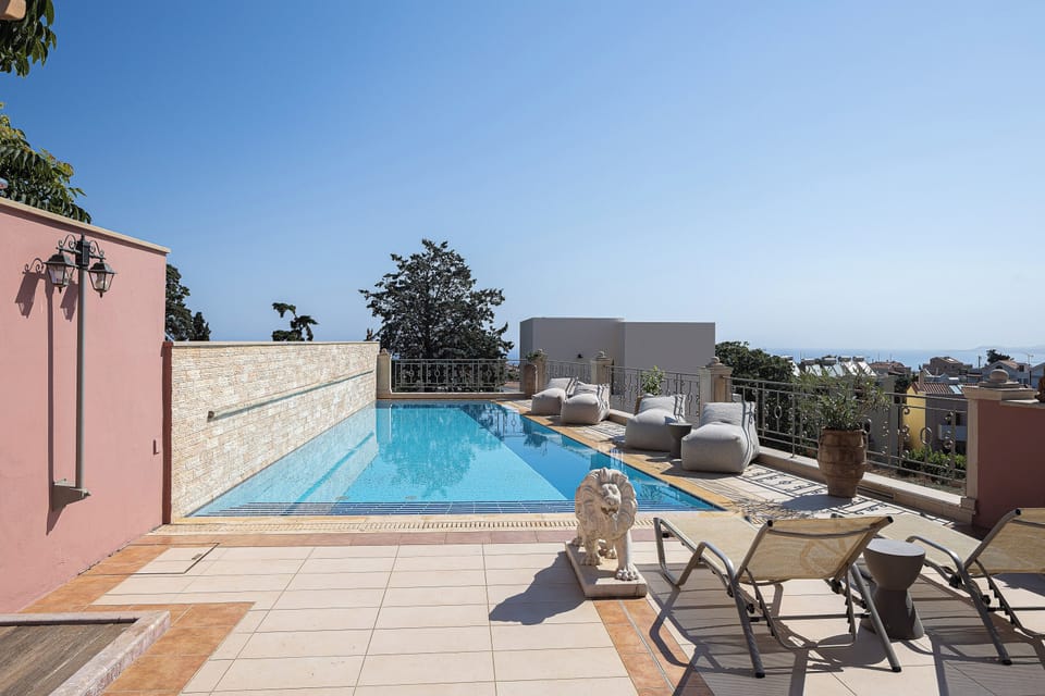 Stretch out beside the pool as Cretan light warms the ancient stone.