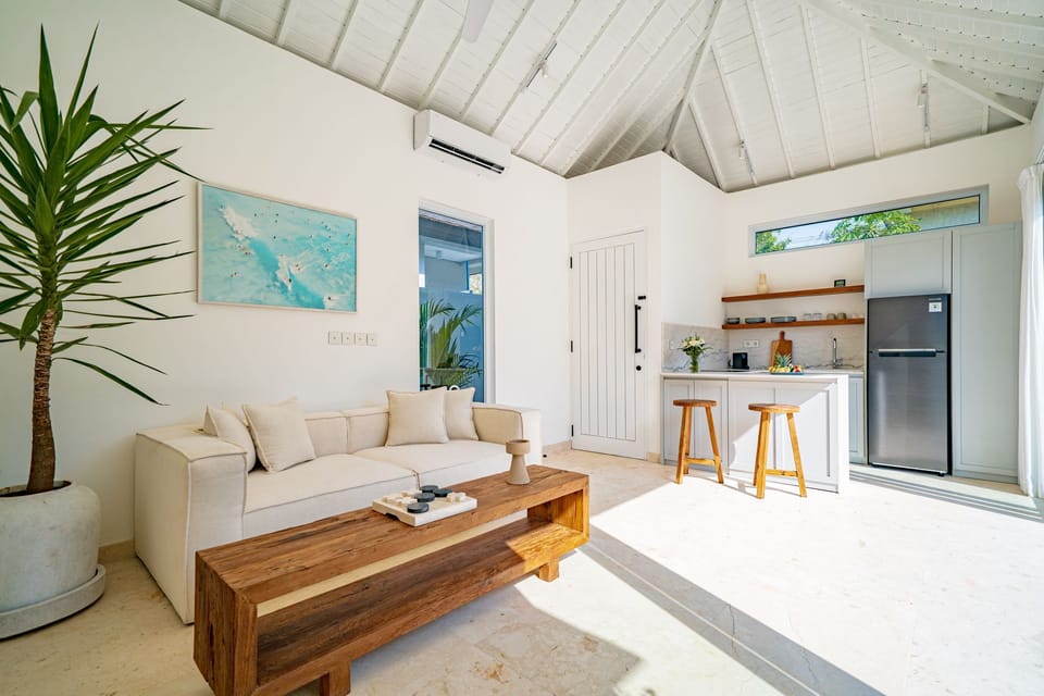 Deluxe Villa, 1 Bedroom, Patio, Pool View | Living area | 43-inch TV with cable channels