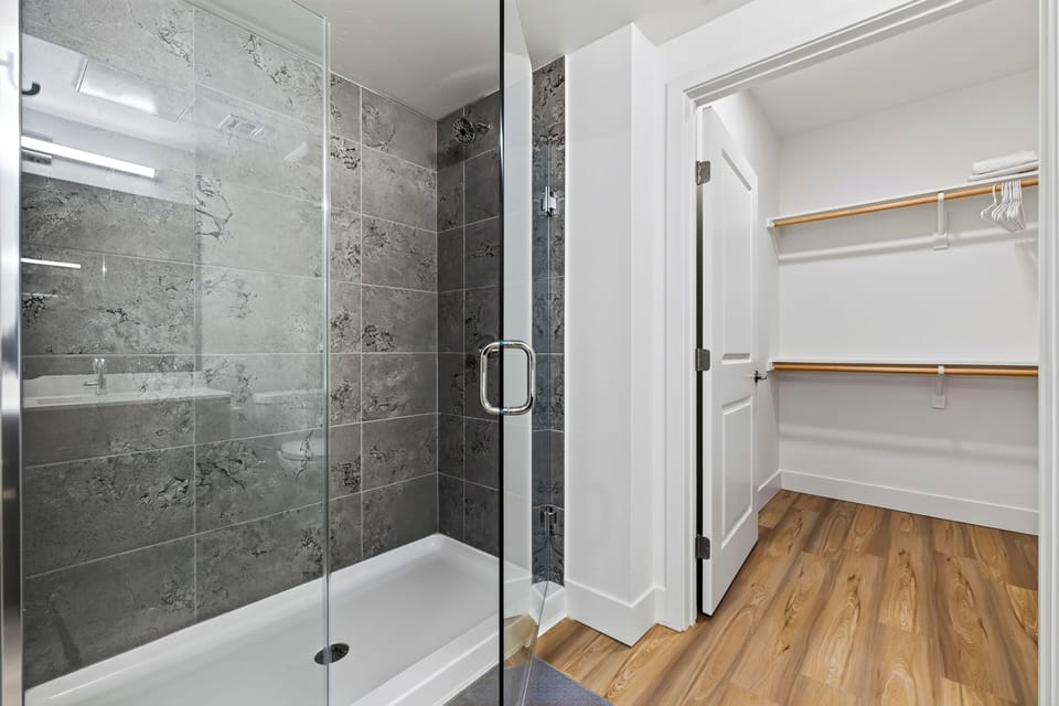 The bathroom features a shower.