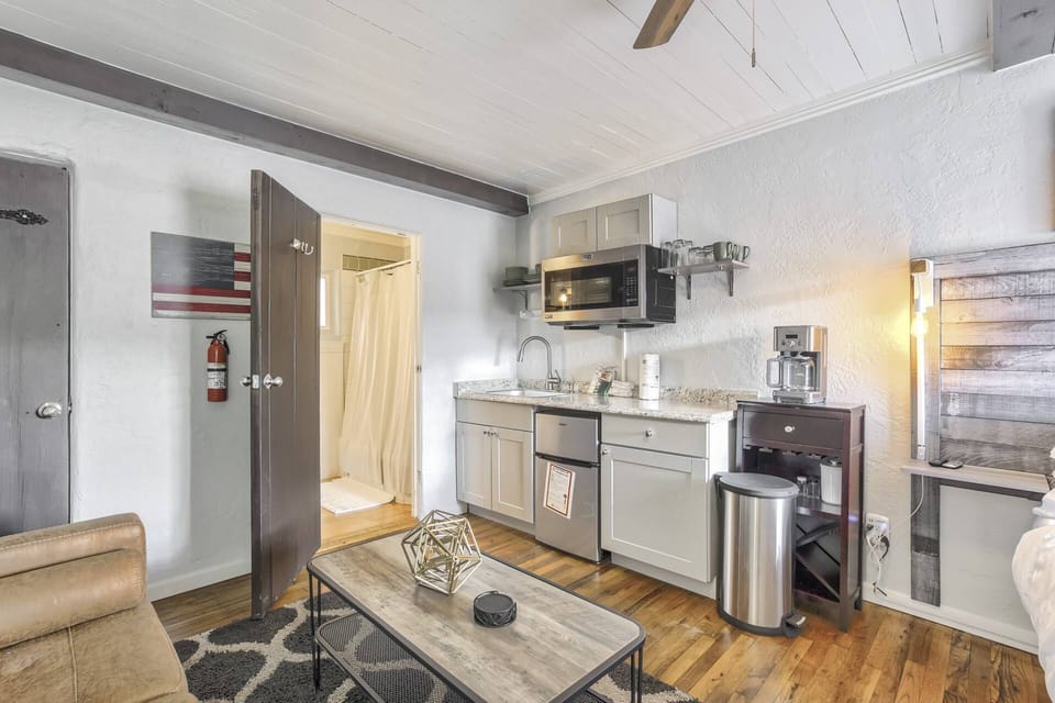 Kitchenette with a coffeemaker, microwave, sink