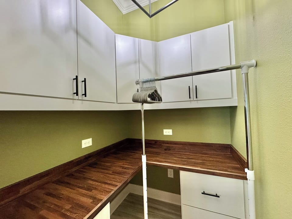 Dual Walk-in Closet/Workstation in Guest Bedroom #2. Desk & Chair & Also Clothing Rack & Shelves for Folded Clothing