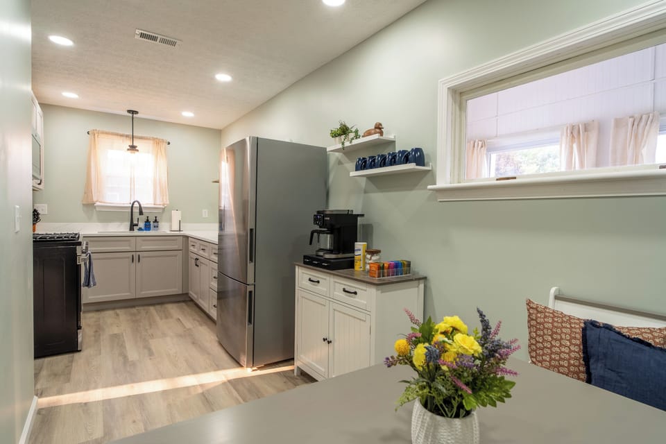 Open dining area to the kitchen, small coffee bar with provided K-Cups, creamer pods and sugar for your stay.
