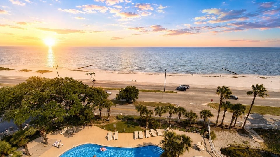 Resort Pool & Beach Views - Overlook the beachfront pool and shoreline of the Mississippi Gulf Coast beach from above while you lay back and relax.