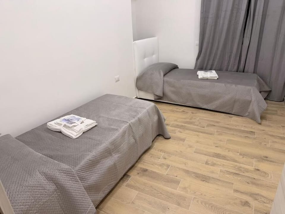 Twin Room, Courtyard View | Desk, blackout drapes, soundproofing, iron/ironing board