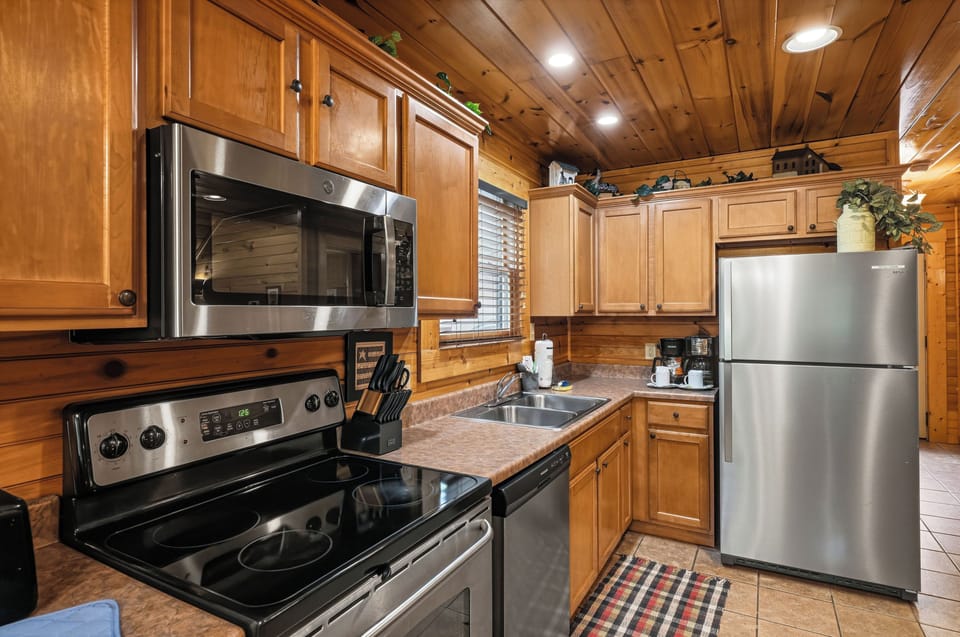 Kitchen with modern appliances and cookware