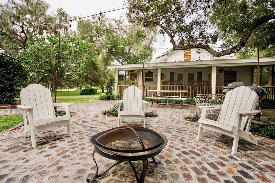 Gather around the fire pit as evening settles in - the porch just steps away. 