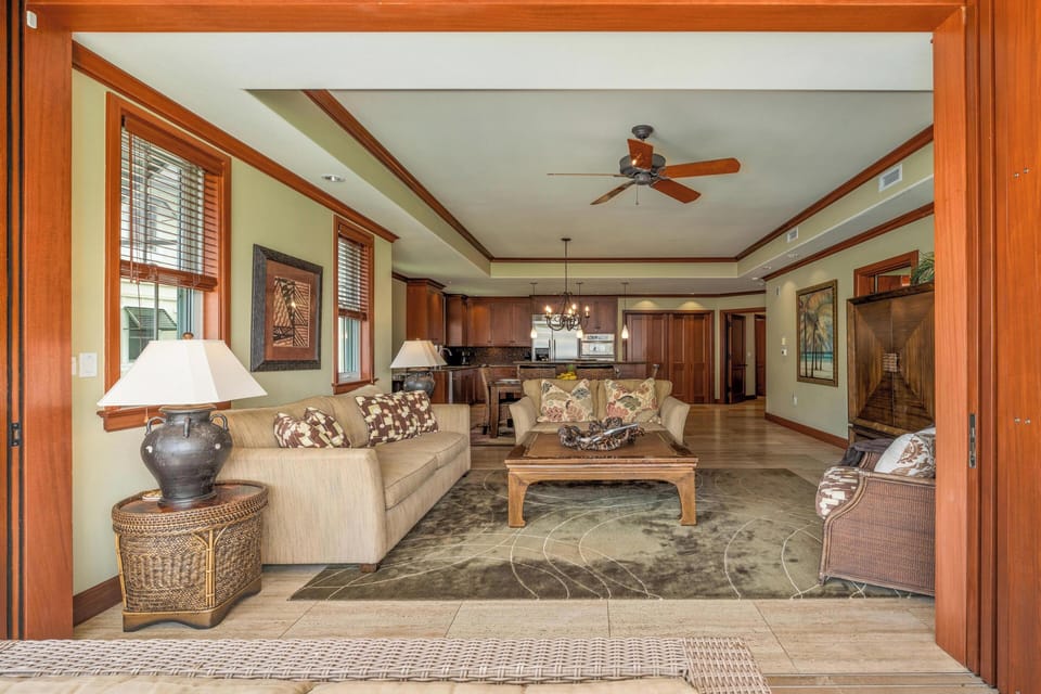 Step into your spacious open-plan retreat, where warm wood accents and island-inspired décor invite you to unwind. The airy living area flows seamlessly into your fully-equipped kitchen, perfect for relaxing evenings at home.