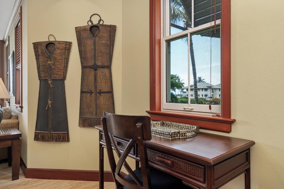 Your private workspace awaits, where tropical breezes drift through the window and warm island light brightens your day. Thoughtful touches create a peaceful corner for planning adventures or unwinding.