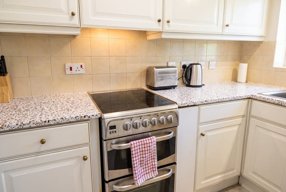 Sleek electric hob and double oven ready for your favourite recipes