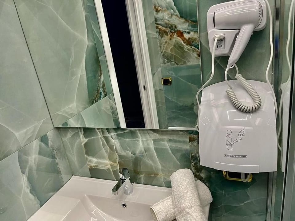 Superior Double Room, Balcony, City View | Bathroom | Shower, free toiletries, hair dryer, towels