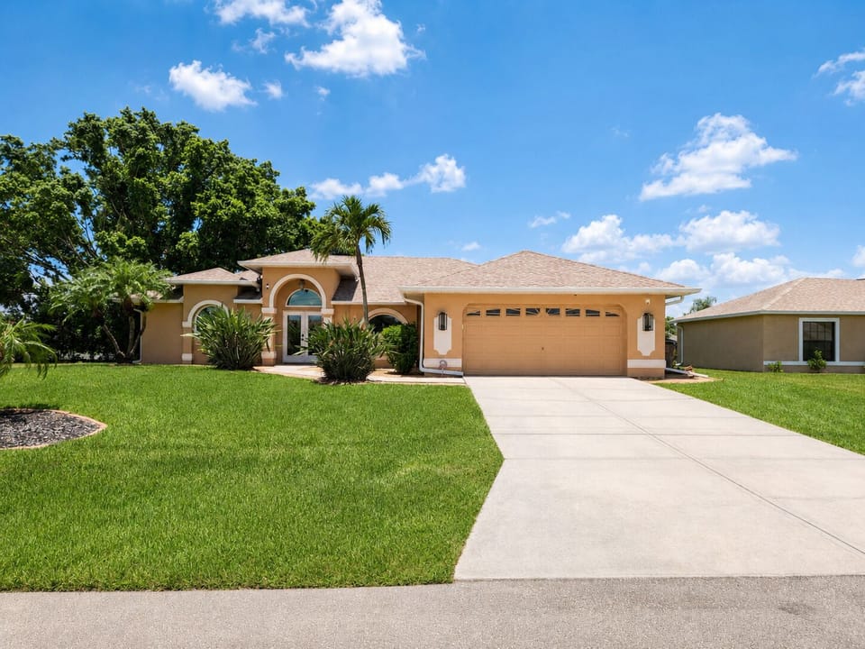 Front view of our vacation home with good size driveway and access to the garage
