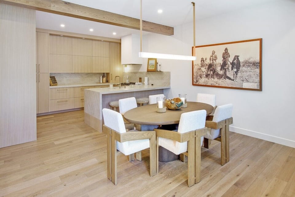 Take a seat at the stylish dining table, the kitchen just steps away in this open, easy flowing space. Made for gathering, made for making memories together.