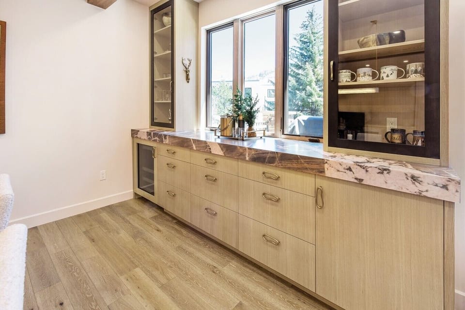 Raise a glass at the built in bar, stocked and ready with wine fridge and glassware. Every night here feels like apres ski, celebrating another great day.