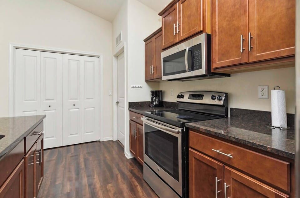 Modern kitchen with stainless appliances and ample cabinet storage