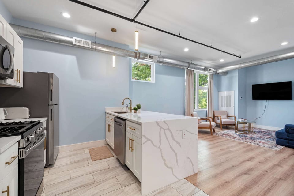 Spacious kitchen w/ central island & bright open layout.