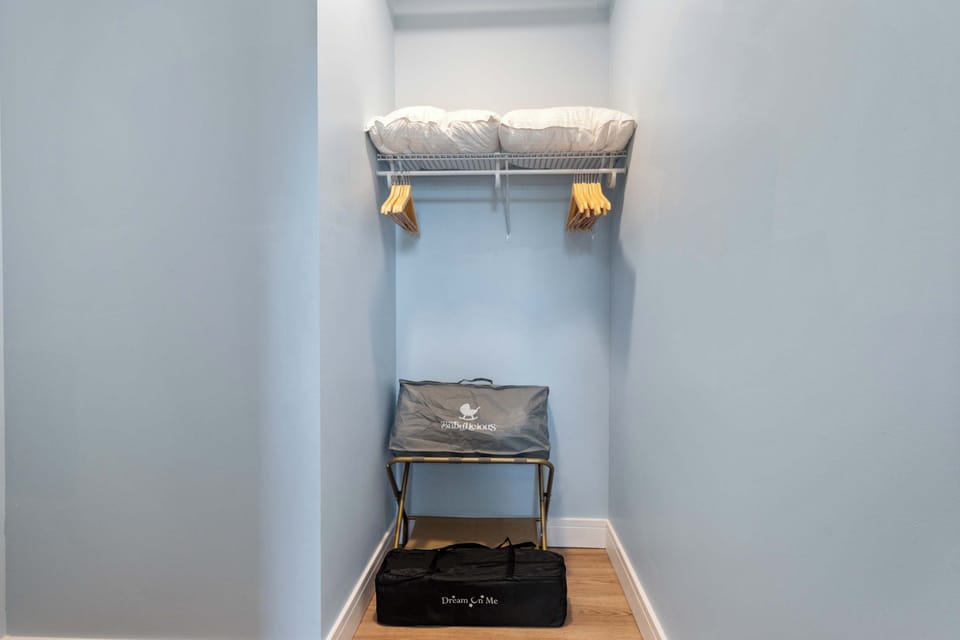 Compact laundry closet keeps things tidy & out of sight.
