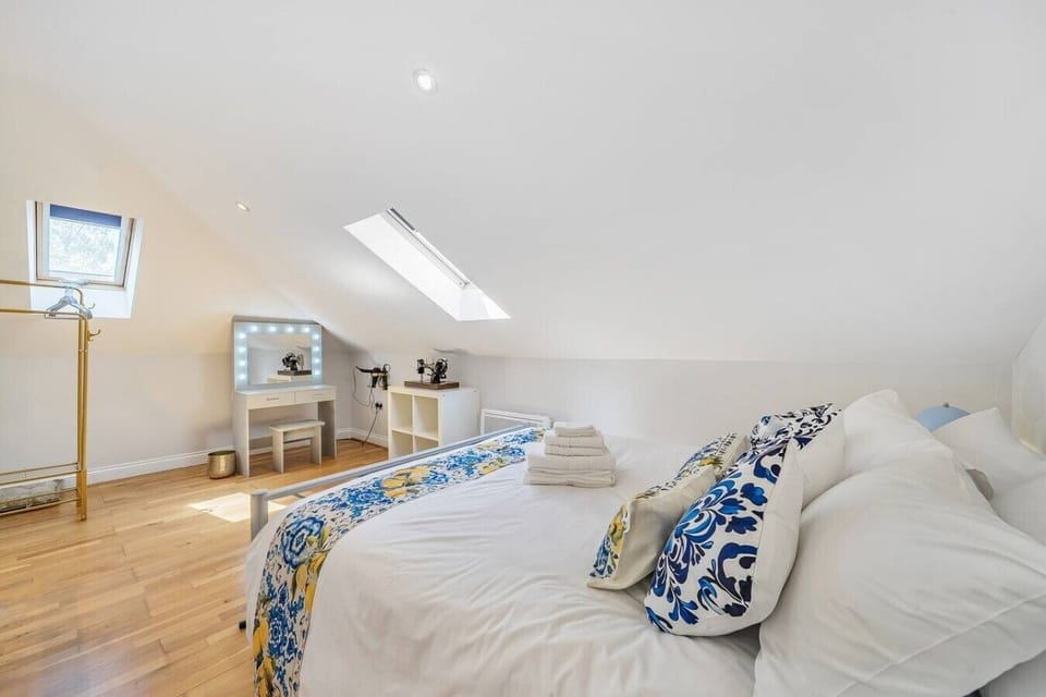 Cosy attic retreat with glam vanity and soft natural light