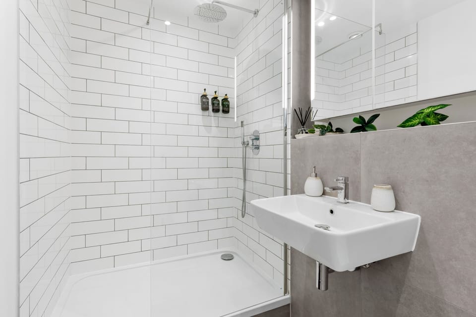 Modern spa-style bathroom with walk-in rainfall shower