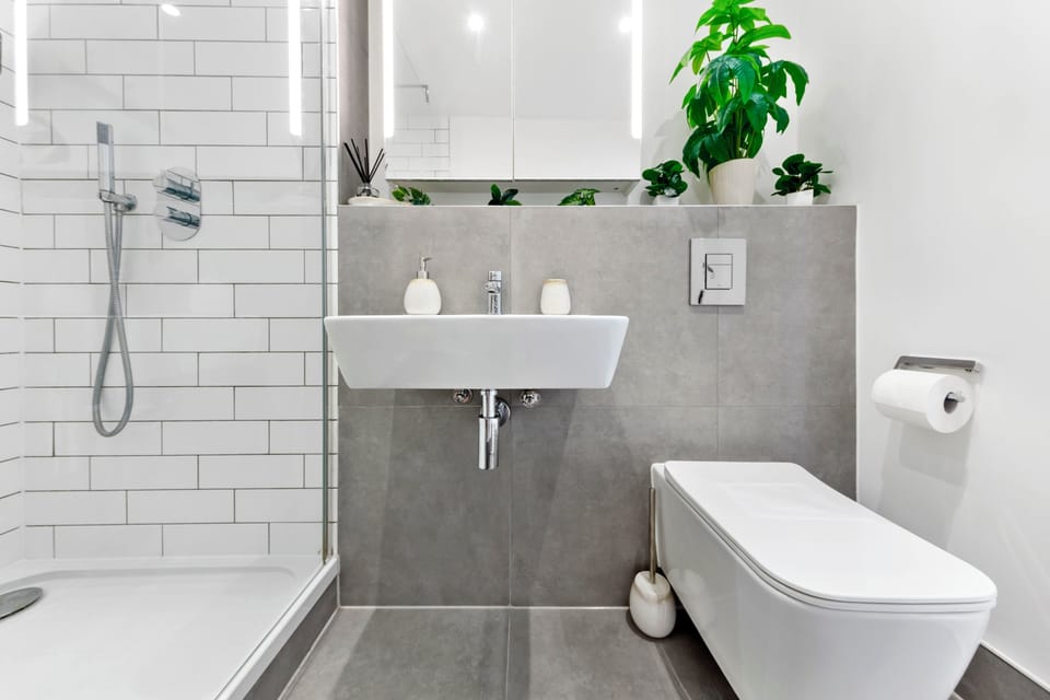 Modern spa-like bathroom with walk-in shower and stylish finishes