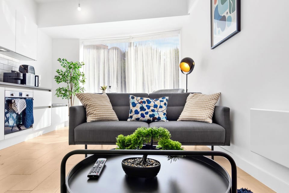 Bright modern lounge with stylish decor and open-plan kitchen