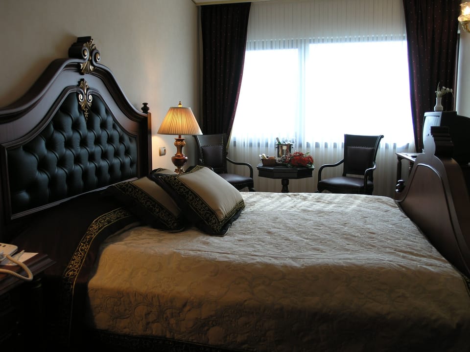 Standard Double Room | Minibar, in-room safe, desk, blackout drapes