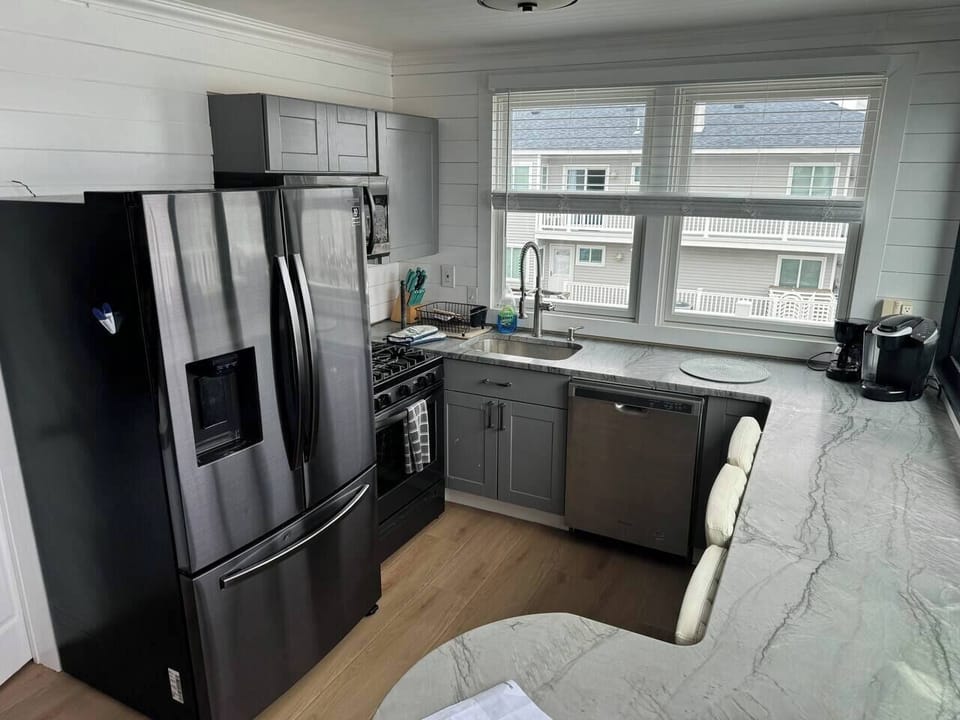 Kitchen with gas stove and quartz countertops