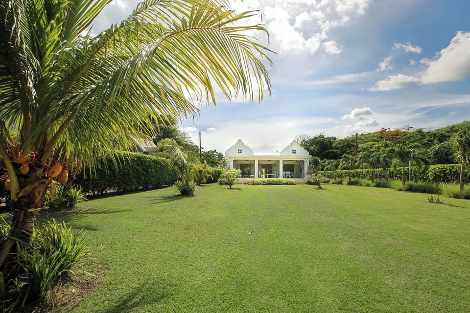 The private lush tropical garden in front of the property