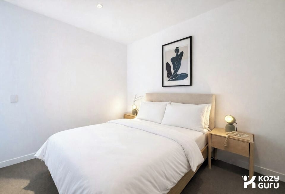 Bright and tidy bedroom with comfortable bedding